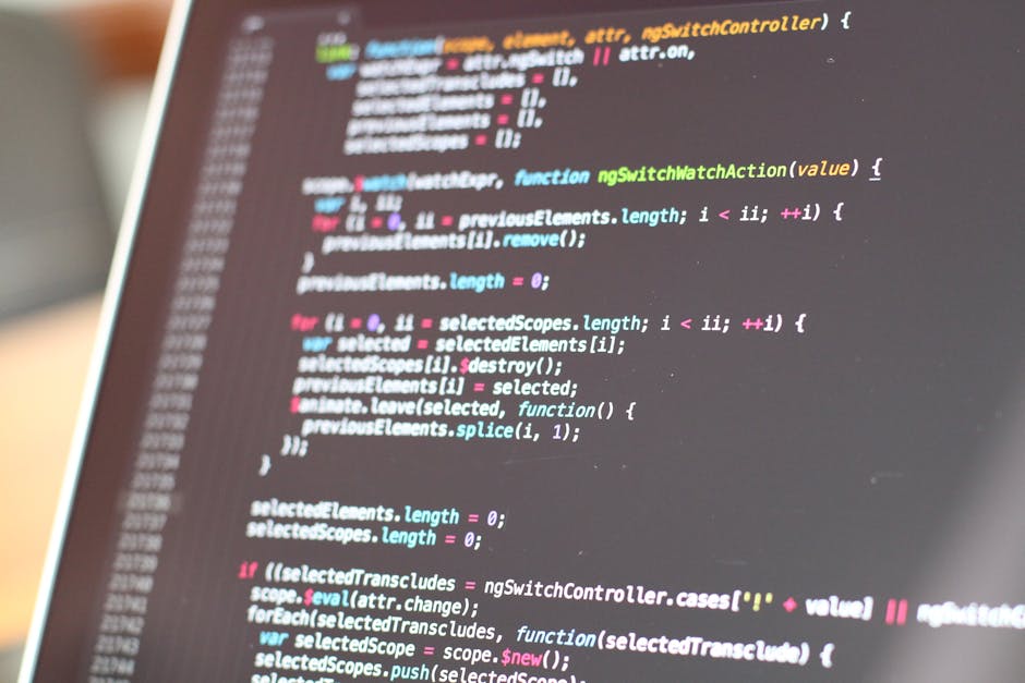 A close-up of a computer screen displaying lines of colorful programming code, with syntax highlighting in shades of blue, pink, green, and white. The code appears to be JavaScript or a similar langua